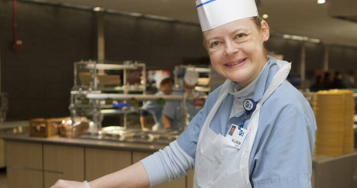 GCE employee Allison Ashmore smiling in a cafeteria