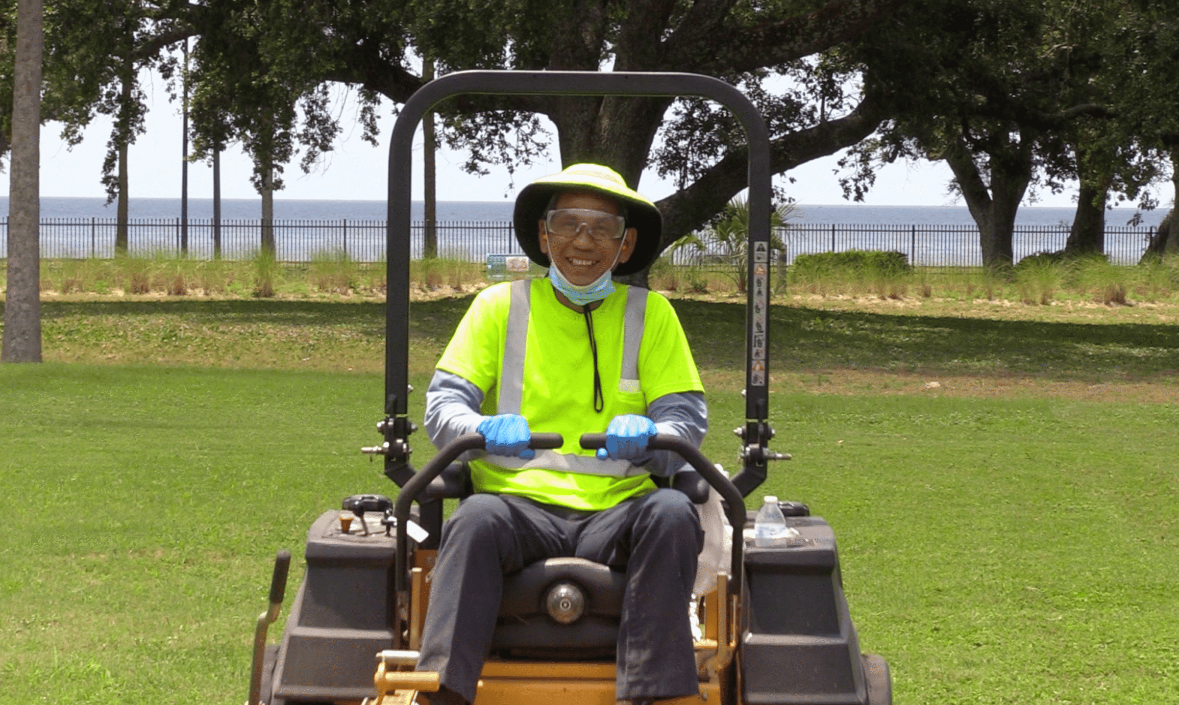 man riding lawn mower