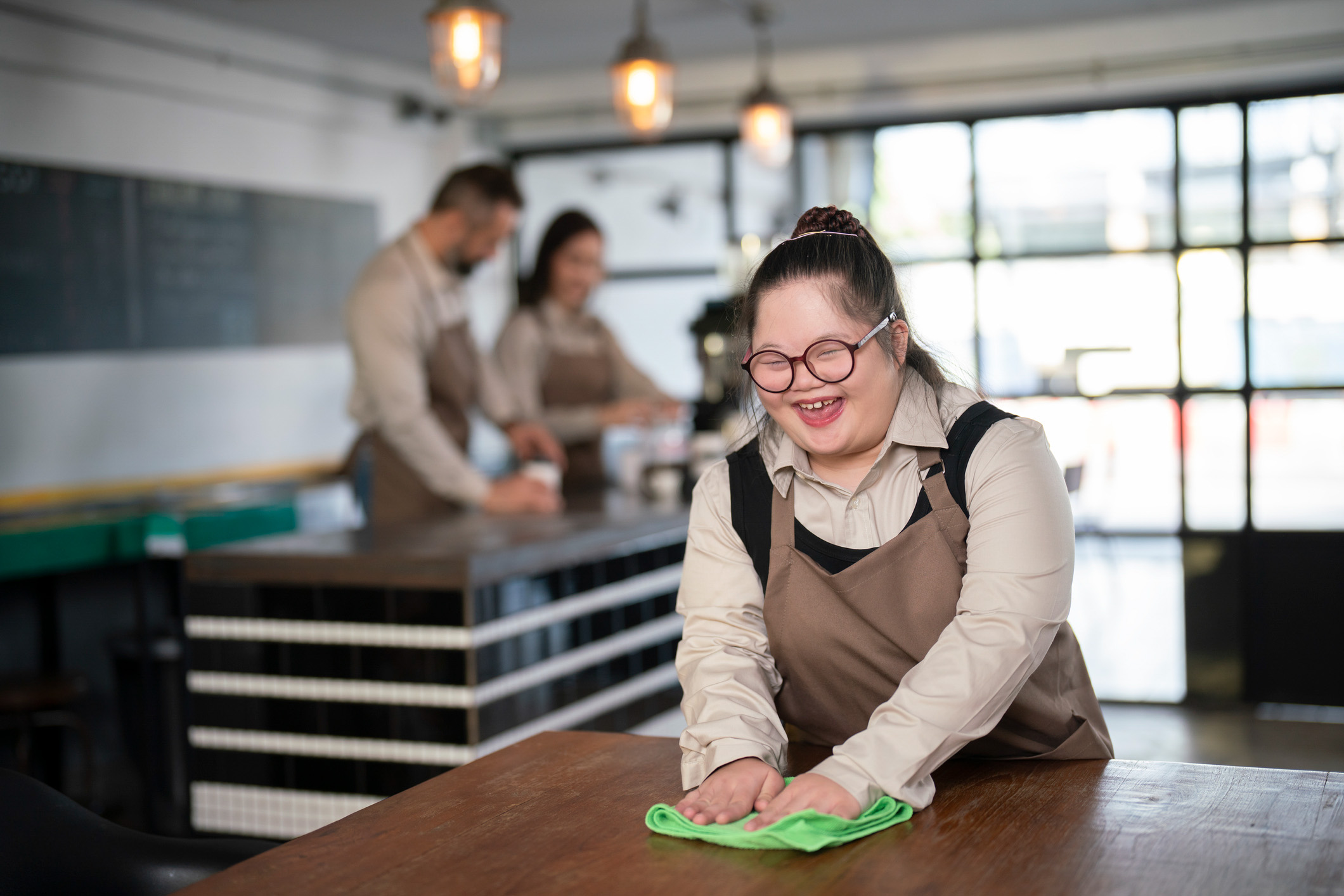 young girl wiping tables