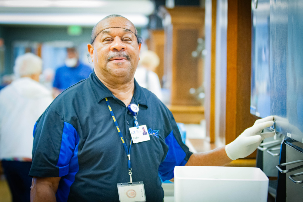 Food services worker at drink station
