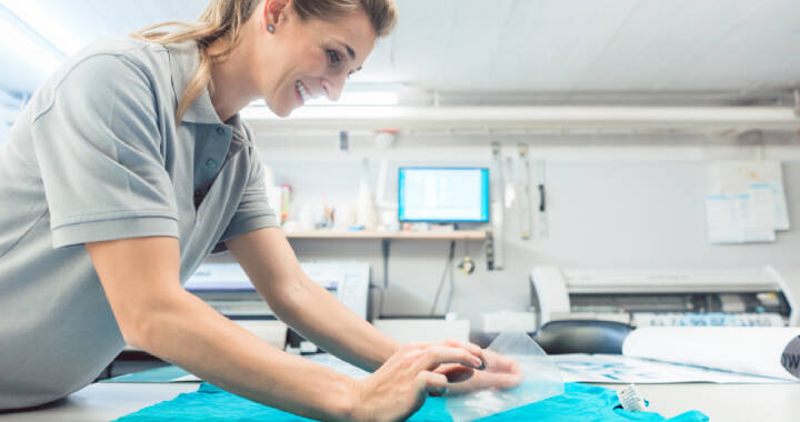 Woman working on branded shirt