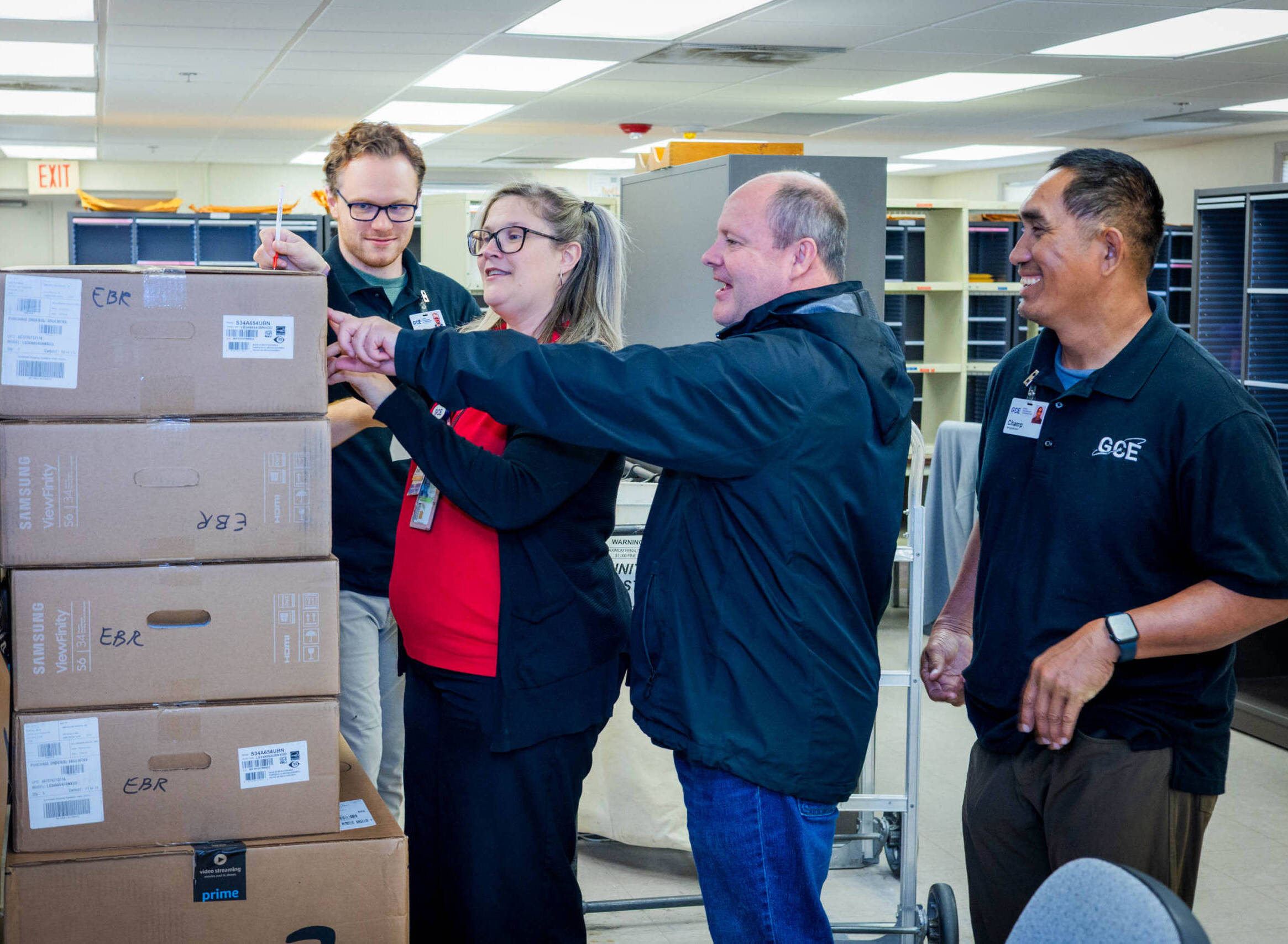 Group of people organizing boxes