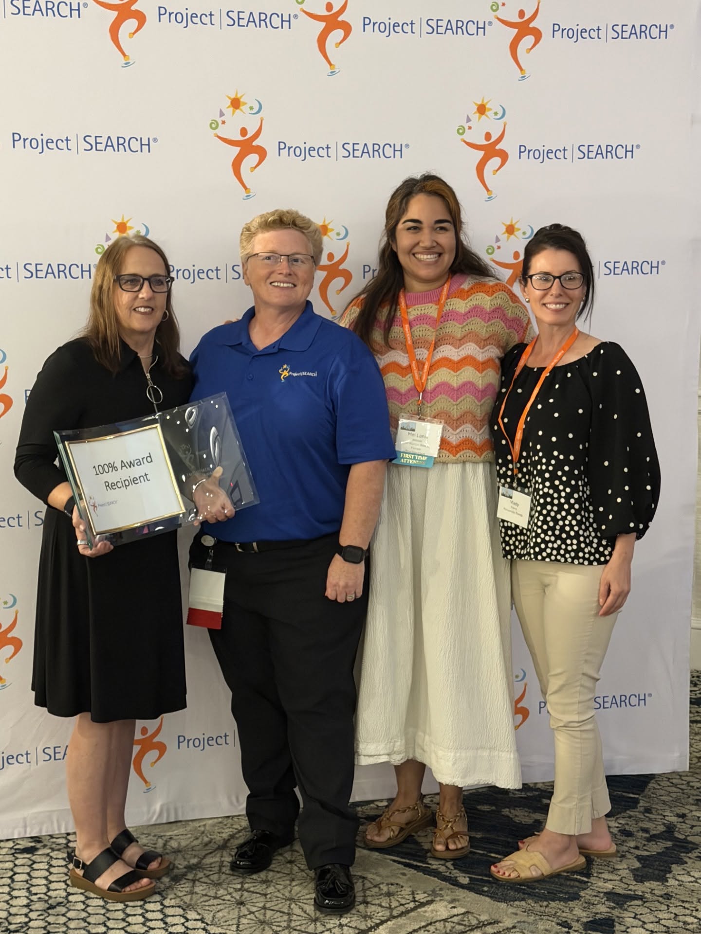 Photo of four Project SEARCH leaders. Left to right: Lisa Bloodworth/Senior Director of Transition and Support Services with GCE, Carly Detlefsen/Program Specialist with Project SEARCH, Mei Lanie Bilbow/Employment Transition Specialist with GCE, and Vlady Fierro/Employment Transition Specialist with GCE.