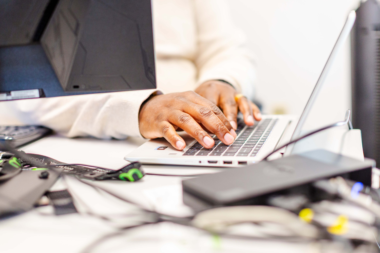 Closeup of hands on a laptop keyboard